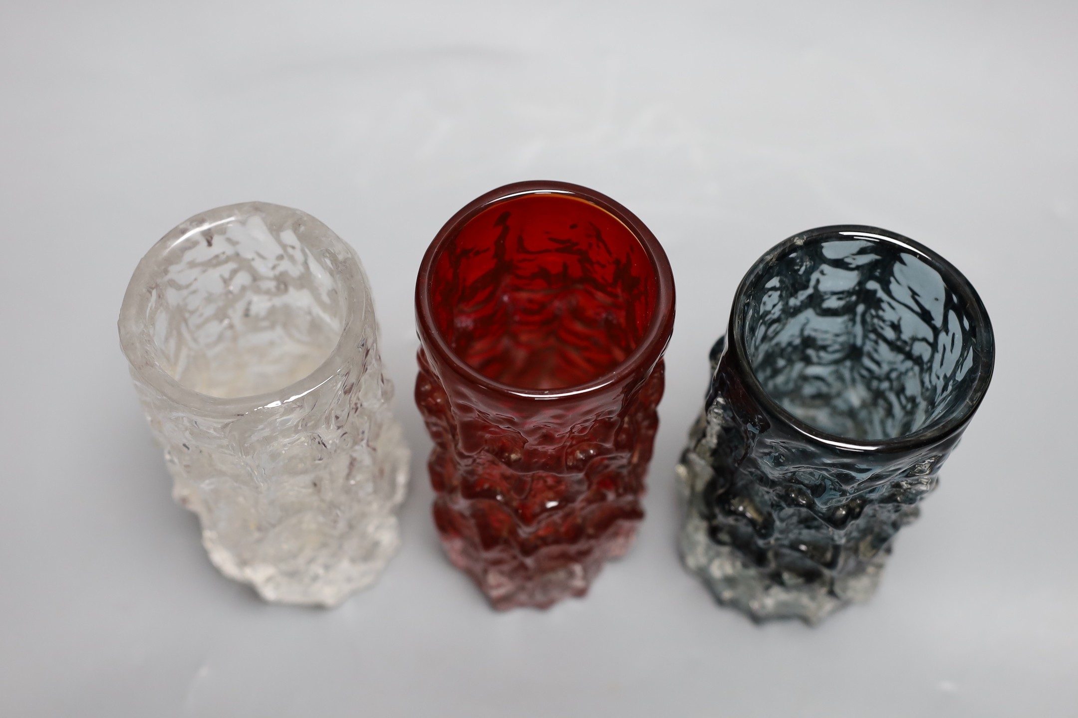 A trio of Whitefriars 'bark' vases, designed by Geoffrey Baxter, various colours, 15cm high.